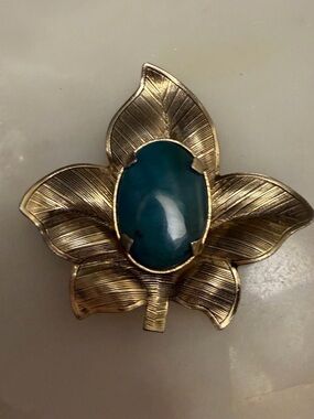 Silver tone leaf brooch with blue cabochon stone pin